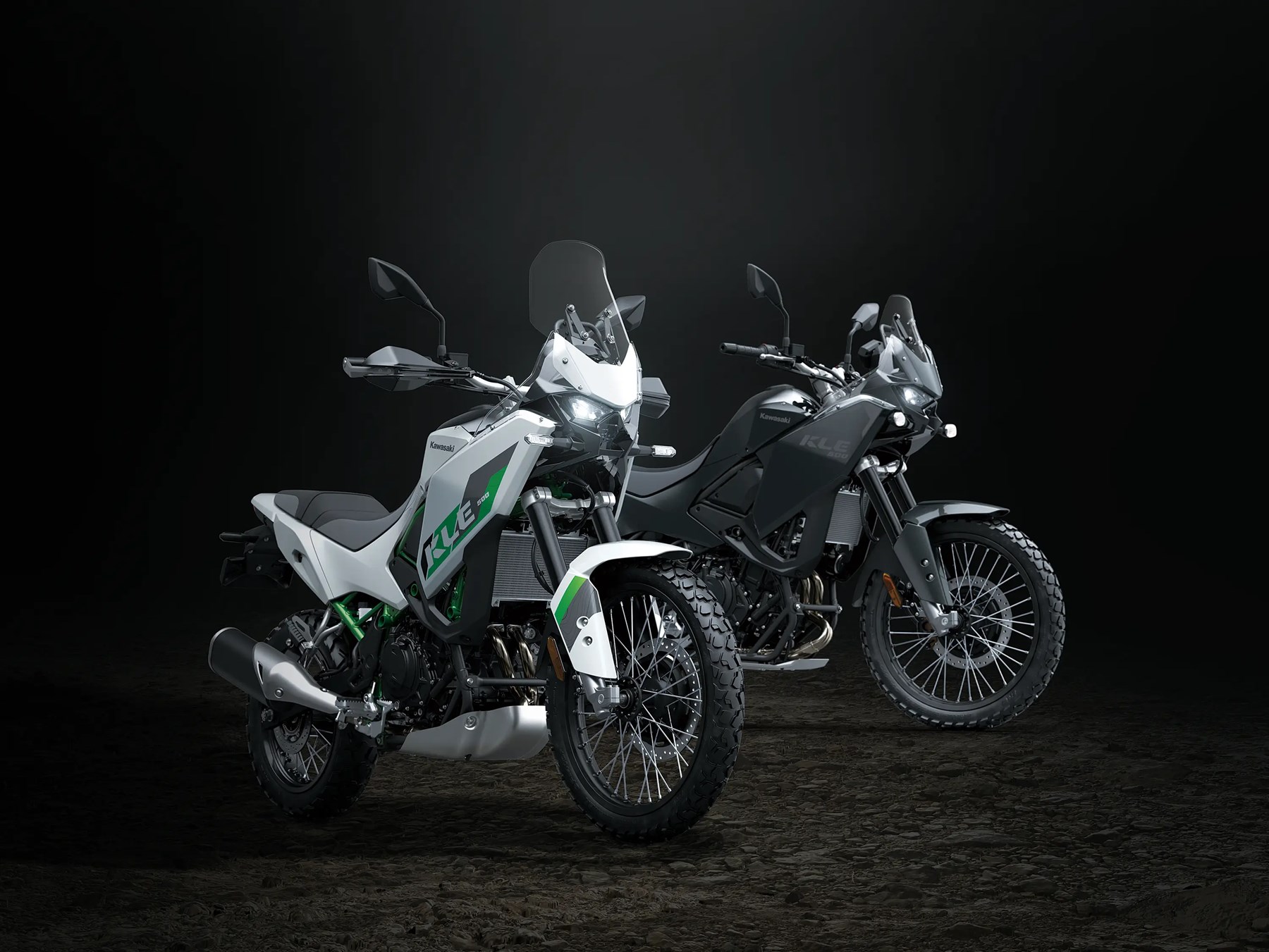 Two Kawasaki KLE 500 motorcycles in studio